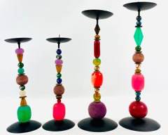 Four Wonderful Whimsical Handcrafted Candle Holders With Black Metal Bases And Colorful Beaded Stems. Each Holder Features A Unique Assortment Of Beads In Varying Shapes, Sizes, And Colors.
