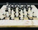 Wonderful Marble Inlaid Chess Board With Black And White Chess Pieces.
