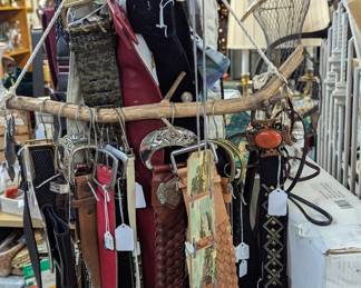 Several accessories - belts, scarves, gloves, hats, hand bags, and more.