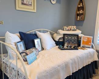 Day /trundle bed we have two excellent mattress and a beautiful iron bed 