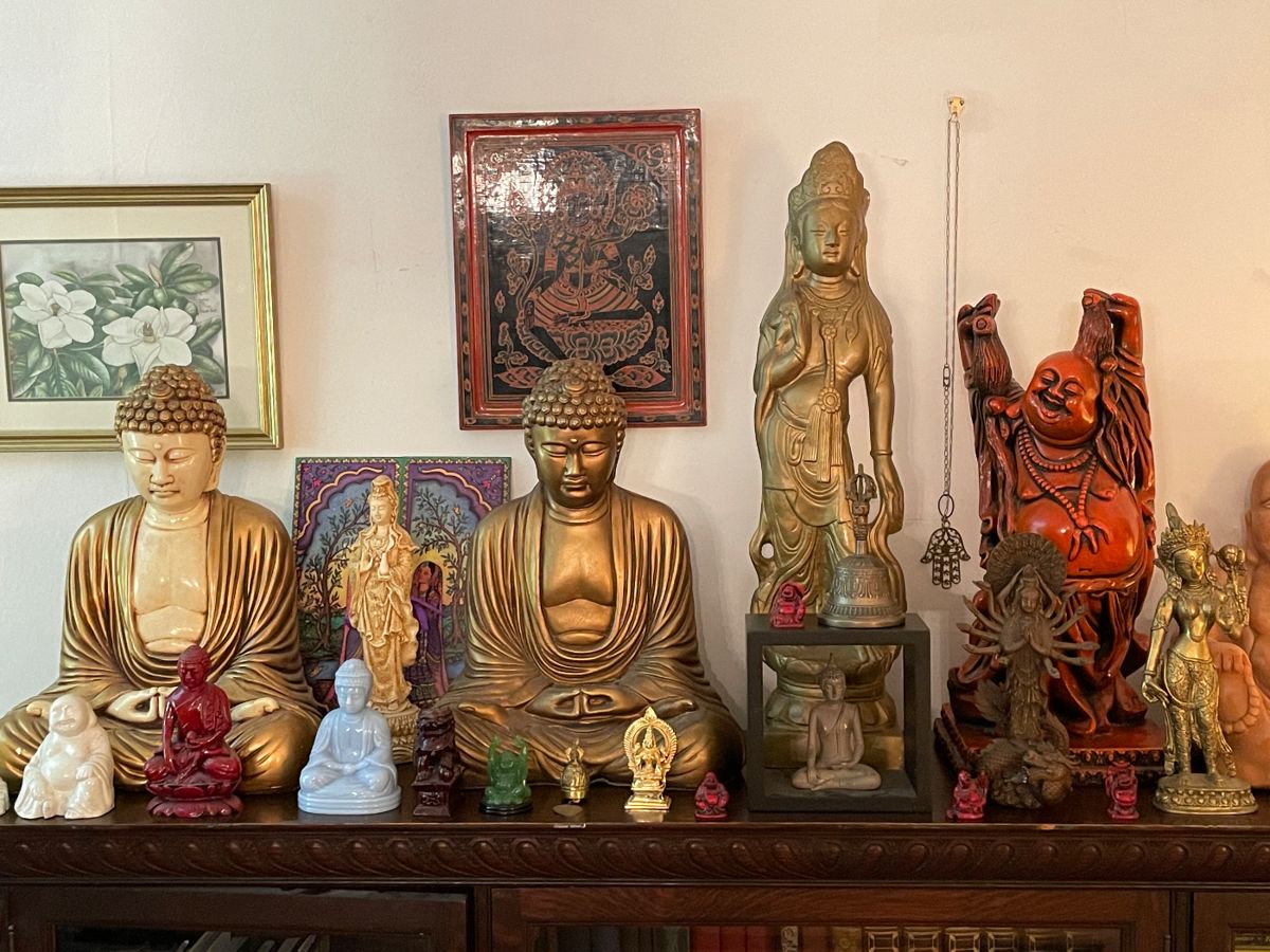 Collection Of Buddha Statues And Figurines