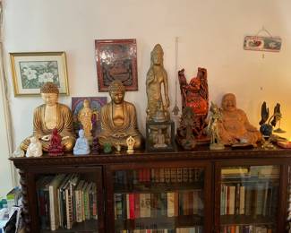 Collection Of Buddha Statues And Figurines