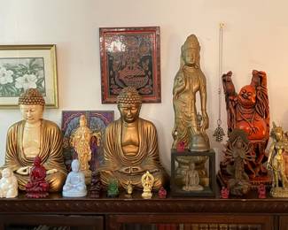 Collection Of Buddha Statues And Figurines
