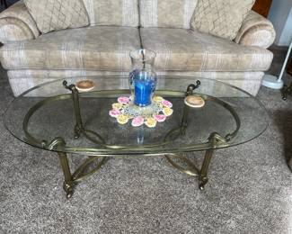 Brass and beveled glass coffee table, 51.50 x 26”