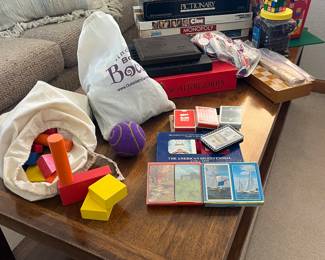 Games including Legos, indoor Bocce ball, decks of brand new cards, and more.