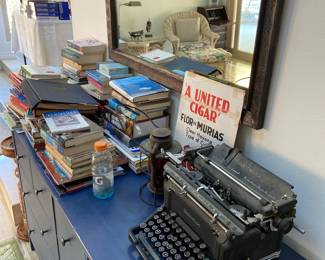 Vintage typewriter, books, mirrors, artwork