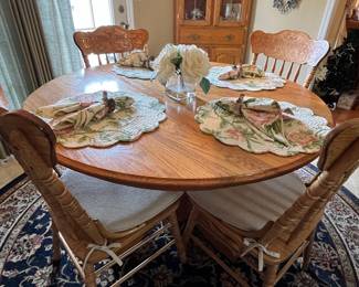 round oak table with four chairs