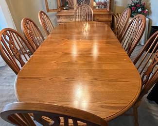 large oval table with eight chairs