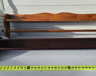 Mounted wooden quilt racks.