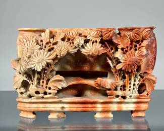 CHINESE SOAPSTONE TRIPLE VASE | Reticulated soapstone carving designed as two oval vases flanking a central rectangular vessel [lacking lid], with carved and openwork decoration of a bird among flowers. - h. 4.5 x l. 7.5 x d. 3.25 in 