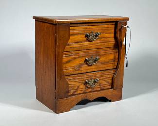 MINIATURE SIDE-LOCK CHEST | Chest with Walnut case and oak drawers. Brass handles and side locks with key. - h. 11.5 x w. 6.25 x l. 11 in