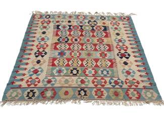 FLAT WOVEN KILIM RUG | Having colorful medallions on alternating tiles of color over a beige ground, pale blue border. -  w. 97 x l. 117 in