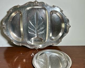 (2pc) SILVERPLATE ITEMS | Including a Wilcox, three compartment well and tree platter with scroll applied decoration, plus an Italian contemporary round plate. -  l. 22 in (platter)
