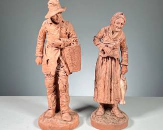 (2pc) Joseph Le Guluche (1849-1915) | A pair of terracotta figures signed J. Le Guluche, man and woman peasants, the man holding a basket and the woman holding a fish. - h. 12 x dia. 4 in (Tallest)