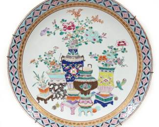 MONUMENTAL CHINESE FAMILLE ROSE CHARGER | Showing various bouquets in vases with colorful gilt rim. - dia. 17.75 in-