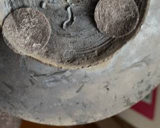 Signature under previous vase