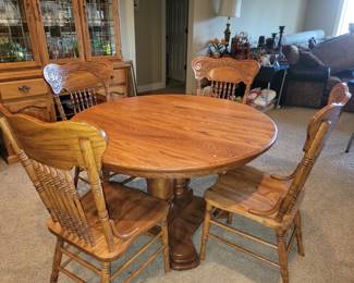 Table, 3 leaves & 6 carved back chairs