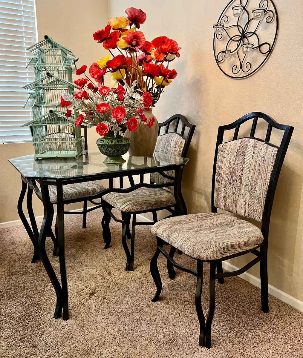 Glass top table with three iron chairs Vintage wood bird house