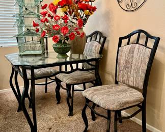Glass top table with three iron chairs Vintage wood bird house