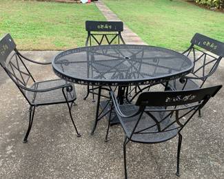 #132 Black Wrought Iron Oval Table w/4 Chairs - 38x60 Table has a base for umbrella $120.00