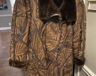 #264 faux fur lined short coat with leather pattern outside size large $40.00