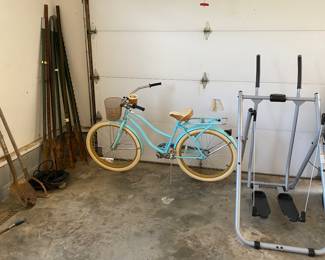 Huffy beach cruiser bike, exercise machine, 20 metal fence posts, various garden tools 