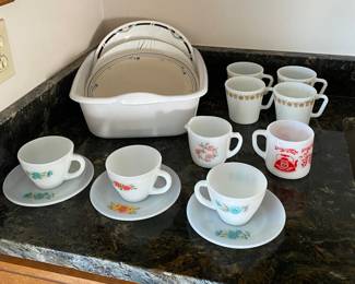 Various Corelle plates, Pyrex and Fire King cups and saucers.