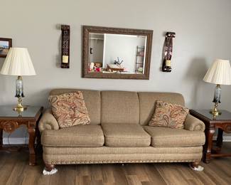 Sofa, end tables, framed mirror, lamps, framed mirror and metal scroll candle holders