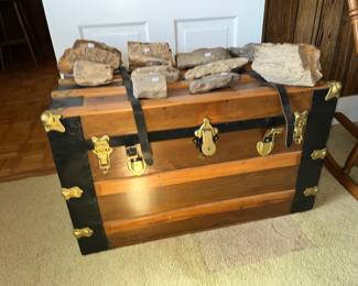 One of several restored antique trunks with some petrified wood samples on top! 