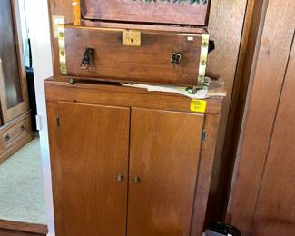 Small wooden storage cabinet and a restored child's trunk on top!