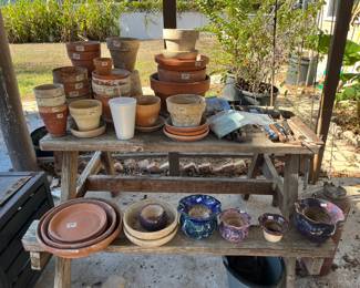 Small picnic table loaded with pots!