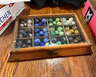 Antique glass case full of old marbles!