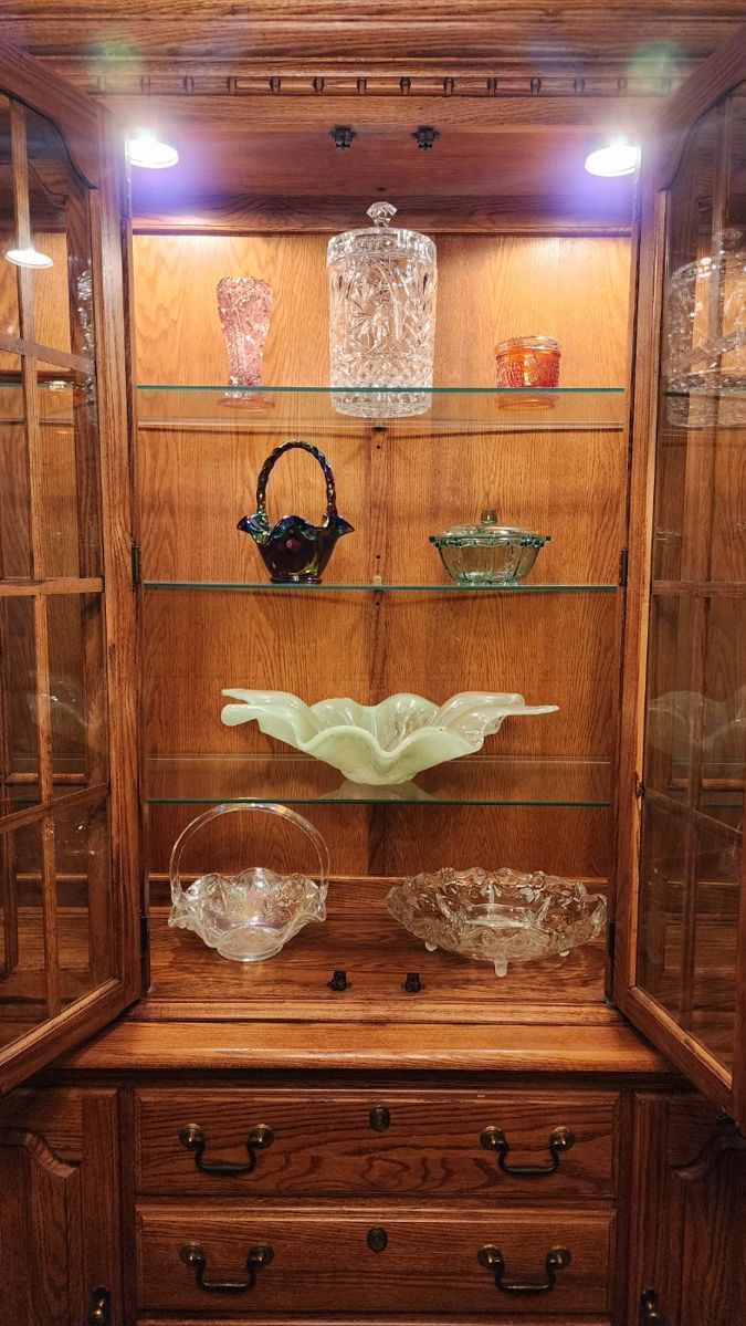 Solid oak china cabinet with some of the glass treasures, including a green Murano centerpiece!