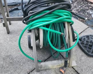 Many hoses and hose cart