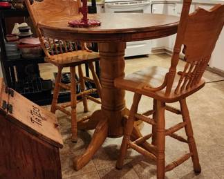 High top oak dinette table with swivel chairs