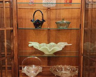 Solid oak china cabinet with some of the glass treasures, including a green Murano centerpiece!