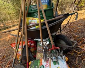 Wheelbarrow Spreader with Lawncare Tools and Supplies