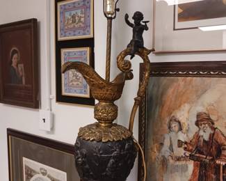 Antique lamp with cherub on the handle