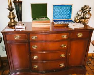 Antique mahogany buffet. Modern knife set