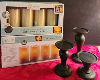 2 4pc Set Of LED Candles With Dail Timer And A Set Of Black Resin Pillar Holders