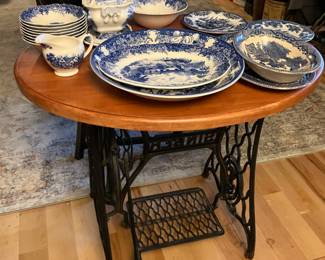 Small round table top with Singer sewing machine base