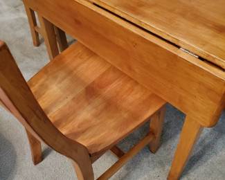 This is lovely Golden Oak drop leaf table with two chairs.