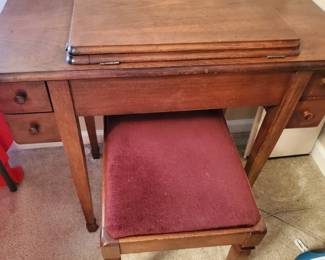 Cabinet and Stool with sewing machine.  The stool has metal supports on the  top edges for support.  Well made.  