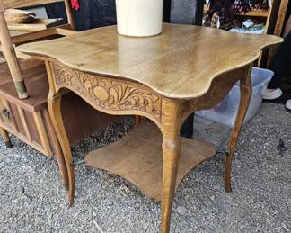 Beautiful oak side table with amazing detai. Even down by the legs.