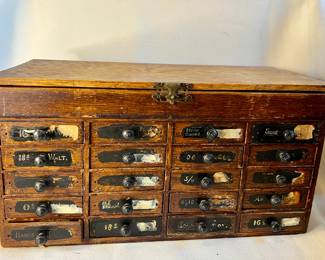 Antique watchmaker's wooden chest filled with findings
