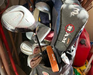 Assorted golf clubs