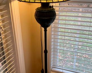Metal floor lamp with Tiffany style green shade