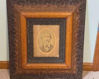 Antique portrait in ornate frame