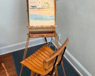 Artist's easel stool and a sketch book with unsigned watercolors