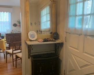 Marble shelf, Mirror in a frame on a mantle  